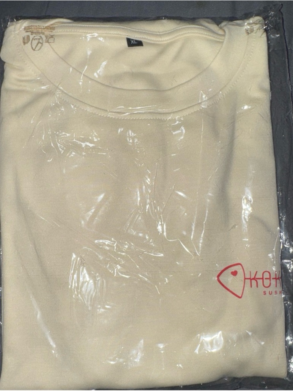 Cream Graphic Tee with Small Red Logo